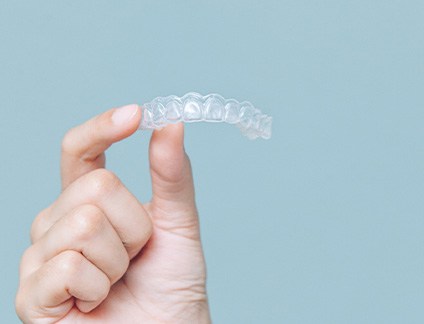Patient holding clear aligner