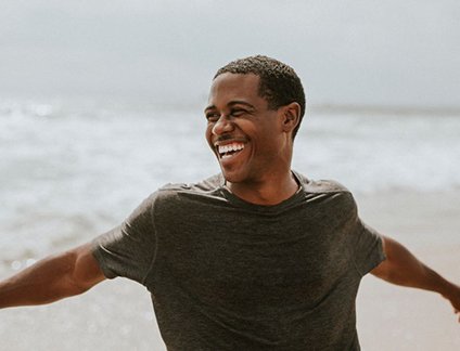 Happy, smiling man enjoying time outdoors
