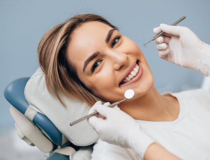 a patient smiling while undergoing dental treatment