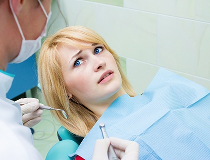 Woman afraid at the dentist